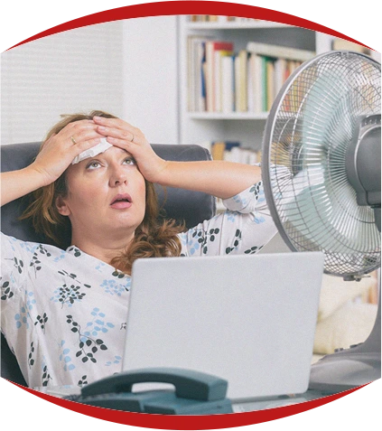 woman-sitting-infront-fan-hot-sweaty-laptop-looking-for-ac-service-delano-ca